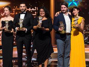 Sudabeh Mortezai (center) poses with her trophy. (Source: AFP)