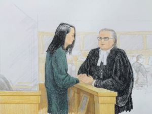 In this courtroom sketch by Jane Wolsak and released to AFP by the artist, Meng Wanzhou (L), Huawei's chief financial officer, speaks with lawyer David Martin in the courtroom in Vancouver. (AFP/ File)