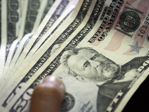 Counting the money. It was a nice surprise for Virginia man who bought the lottery ticket and stashed it away for a month only to find out he had become an overnight millionaire. (AFP/File Photo)	