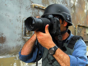 Being a photographer in a country rapidly descending into conflict (Shutterstock).
