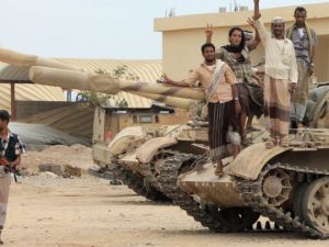 Anti-Houthi militants stand on a tank in southern Yemen (AFP/File Photo)