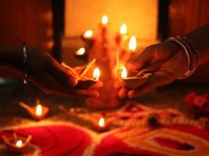 Devotees hold oil lamps as they celebrate Diwali in Allahabad on November (Sanjay Kanojia/AFP/Getty Images)