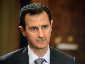 "In 10 years, if I can save Syria as president –- but that doesn't mean I'm still going to be president in 10 years, I'm just talking about my vision of the 10 years," he said in an interview published on the newspaper's website. (AFP/Joseph Eid)