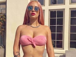 Getting curious: Iggy Azalea wants people to stop 'automatically assuming' relationships are all 'traditional' as she questions polyamorous lifestyles on Twitter on Monday (Source: Iggy Azalea - Instagram)