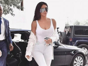 Pounding the pavement: Kim Kardashian was back at it on Monday, posting an Instagram snapshot in which she modeled a slightly sheer white tank top (Source: Kim Kardashian - Instagram)