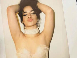 The 21-year-old former Fifth Harmony songstress displayed plenty of cleavage in a lace corset for the snap. (Source: Camila Cabello - Instagram)