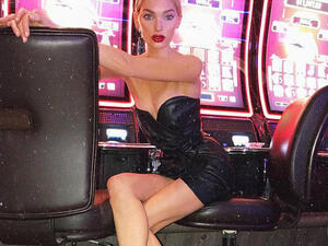 Gambling woman: Elsa Hosk had a great time in Las Vegas this week as she stopped by the Revolve party. The blonde bombshell shared a sultry image to Instagram where she wore a strapless minidress in black as she sat in front of slot machines in a casino (Source: Elsa Hosk - Instagram)