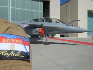 One of three French-made Rafale for the Egyptian Air Force is pictured at an air base in Istres, France, on July 20, over the shoulder of one of the Egyptian pilots trained to fly the fighter jets. (AFP/Boris Horvat)
