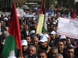 Palestinian protesters demonstrate in Gaza City on January 29, 2018 against the US move to freeze funding for a UN agency helping Palestinian refugees. (AFP)