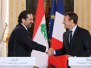 Macron and Hariri shakes hands in September, 2017, AFP/File