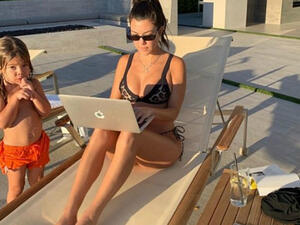 Busy mama: Kourtney Kardashian revealed she was doing he Christmas shopping in a bikini whilst relaxing with her kids in Palm Springs on Saturday (Source: Kourtney Kardashian - Instagram)