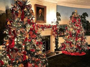 First lady Melania Trump unveiled the White House Christmas theme on Monday, wearing a pair of red leather gloves that matched the gleaming ornaments on the tree. (Twitter)