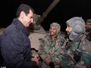 'I like to be with you on this occasion,' Assad told the Syrian troops in Jobar. (AFP/File)