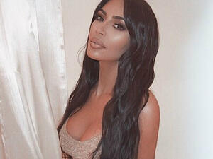 'Golden girl': Kim Kardashian oozes sex appeal in a new Instagram snap she shared on Sunday night (Kim Kardashian - Instagram)