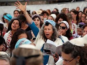 A member of Women of the Wall wears phylacteries and the 'tallit' shawl, traditional Jewish prayer apparel for men. (AFP/Gali Tibbon)