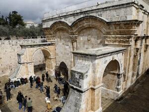 Palestinian Muslim worshippers attend Friday noon prayers at the Golden Gate in al-Aqsa Mosque compound in the Old City of Jerusalem (AFP)