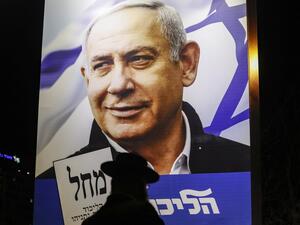 An Ultra-Orthodox Jewish man passes by a billboard showing a Liked Party electoral billboard depicting Israeli Prime Minister Benjamin Netanyahu in Jerusalem on April 7, 2019, two days ahead of the parliamentary polls. 
Ahmad GHARABLI / AFP