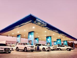 ADNOC distribution station at dusk