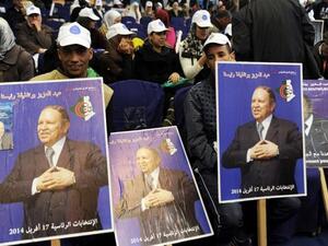 Supporters of Algerian President Abdelazziz Bouteflika gather during a political meeting ahead of the country's presidential election in 2014. (AFP/Farouk Batiche)