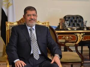 Egyptian president Mohamed Morsi poses prior to a meeting with Iranian Foreign Minister in Cairo. (AFP PHOTO / KHALED DESOUKI)
