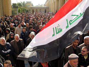 Iraqi demonstrators gather for an anti-government protest outside the Sunni Abu Hanifa mosque in Baghdad. (AFP PHOTO/KHALIL AL-MURSHIDI)