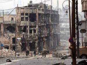 Syrian government troops take position in a heavily damaged area in the old city of Aleppo. (AFP PHOTO/STR)