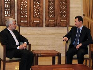 Syrian president Bashar al-Assad talks with Saeed Jalili, who heads the Iranian Supreme National Security Council in Damascus. (AFP PHOTO / HO-SANA)