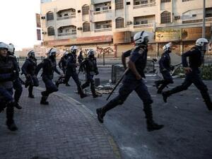 Bahrain police run as they try to disperse protestors during clashes following an anti-government rally to demand political reforms on Wednesday. (AFP PHOTO/MOHAMMED AL-SHAIKH)