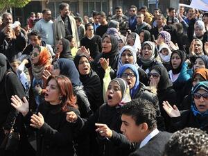 Egyptians rally on Sunday, closing down government offices and factories in the Suez Canal city of Port Said. (AFP PHOTO/STR)