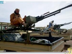 Screen shot posted on jihadist forums by a group calling itself "al-Sahara Media Foundation" reportedly shows al-Qaeda in the Islamic Maghreb (AQIM) fighters preparing for war in northern Mali. (AFP PHOTO / SITE Monitoring Service)