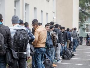 Migrants, mostly Afghan, wait outside a refugee reception centre in Tornio, Finland on September 25, 2015. (AFP/Panu Pohjola) Migrants, mostly Afghan, wait outside a refugee reception centre in Tornio, Finland on September 25, 2015. (AFP/Panu Pohjola)