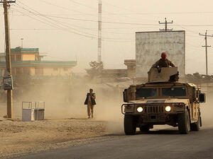 Afghan security forces travel in a Humvee vehicle, as battles were ongoing between Taliban militants and Afghan security forces, in Kunduz, capital of northeastern Kunduz province. (AFP)