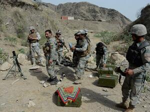 Afghan border policemen take their positions following clashes with Pakistani forces on the border between Afghanistan and Pakistan in eastern Nangarhar province on June 15, 2016. (AFP/Noorullah Shirzada)