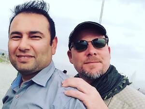 National Public Radio (NPR) photojournalist David Gilkey and Afghan journalist and interpreter Zabihullah Tamanna (L) pictured in Afghanistan on June 2, 2016. (AFP/File)