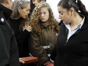Israeli lawyer Gaby Lasky speaks with Ahed Tamimi, her client (AFP/File Photo)	