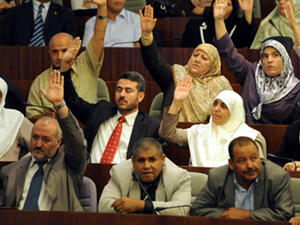 Algerian MP vote during a parliamentary session at the National Assembly in Algiers on October 1, 2012, to adopted an action plan for the new government, focusing on further political reforms in Algeria. (AFP/Farouk Batiche) 