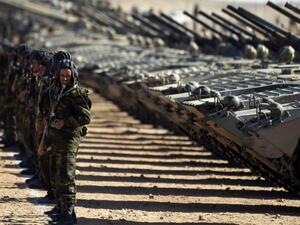 Algerian soldiers stand in front of a row of tanks. (AFP/File) Algerian soldiers stand in front of a row of tanks. (AFP/File)