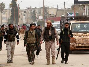 Foreign-backed militants patrol in the Syrian city of Idlib. (AFP/file)