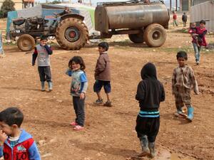 Syrian children play at a refugee camp on the outskirts of the eastern Lebanese city of Baalbek on February 24, 2015. (AFP/File)