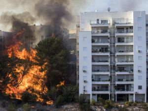 Fire threatens to engulf a tower block in Haifa, Israel. (AFP)