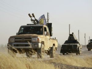 US-backed Kurdish and Arab fighters advance into the Islamic State group bastion of Manbij, in northern Syria, in June 2016. (AFP/File)