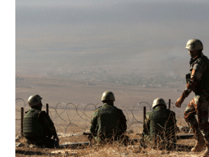 Iraqi Kurdish Peshmerga fighters hold a position on the top of Mount Zardak, about 25 kilometres east of Mosul.  (AFP/File) 