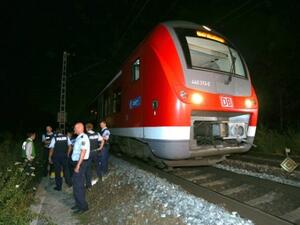 A rescuer at the scene of an axe and knife attack by a 17-year-old Afghan refugee on a regional train in Wuerzburg, southern Germany, on July 18, 2016. (AFP/Karl-Josef Hildenbrand)