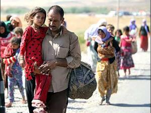  84,000 civilians fled to Erbil, 78,372 to Sulaimani and 6,000 to Duhok and Zakho from Rabea and Zummar (AFP/File)
