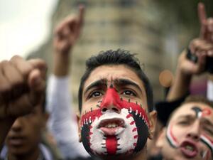 An Egyptian anti-regime protester shouts slogans during a demonstration calling for the interim military rulers to step down in Tahrir Square in Cairo on 27 November 2011. (AFP/Odd Andersen)
