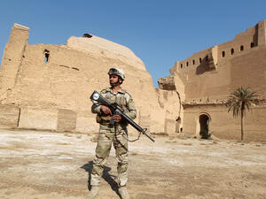 A soldier outside an Iraqi archaeological site (Ahmad al-Rubaye/AFP)