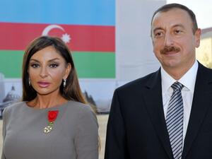 This file photo taken on October 7, 2011 shows Azerbaijan's President Ilham Aliyev (R) posing beside first lady Mehriban Aliyeva after she was awarded with the Legion d'Honneur medal by the French president in Baku. (AFP/Philippe Wojazer)