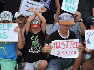 Refugee children take part in a protest in March 2015 against their resettlement on Nauru and living conditions on the island. (Amnesty International) Refugee children take part in a protest in March 2015 against their resettlement on Nauru and living conditions on the island. (Amnesty International)