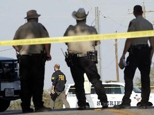 Law enforcement officials gather near the First Baptist Church following a shooting on November 5 (AFP)