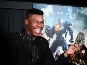 British actor John Boyega plays the son of Idris Elba's character General Stacker Pentecost in "Pacific Rim Uprising," due in theaters March 23. (Source: ILYA S. SAVENOK / GETTY IMAGES NORTH AMERICA / AFP)